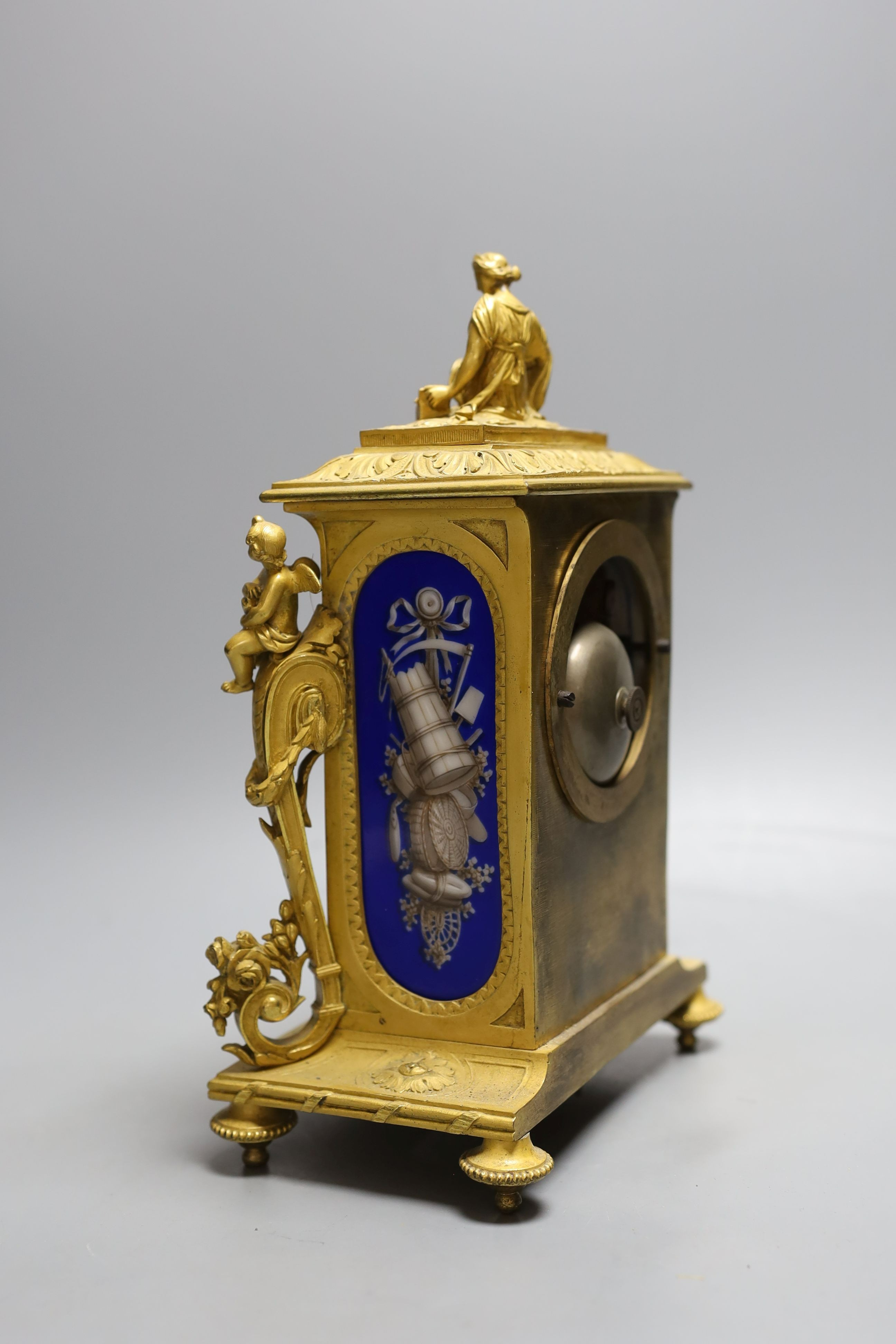 A French ormolu clock with Sevres style blue ground porcelain panels, height 27cm